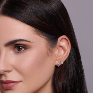 Urban Pizazz odel Wearing 925 Sterling Silver Stud Earrings in an Toi et Moi Design, featuring Pink and Clear Cubic Zirconia Stones