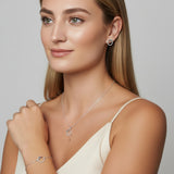 Urban Pizazz Model earing our Sterling Silver Open Circle Jewellery Set featuring a Pendant Necklace, Bracelet and Matching Earrings all with rainbow coloured cubic zirconia details