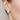 Urban Pizazz Model Wearing Sterling Silver and Cubic Zirconia Leaf and Pearl Studs