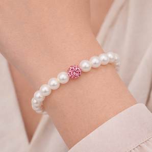 Urban Pizazz Model Wearing Stretchy Pearl Bracelet with Pink CZ