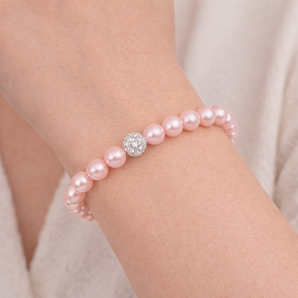 Urban Pizazz Model Wearing Stretchy Pink Pearl Bracelet with Cubic Zirconia Shamballa Bead