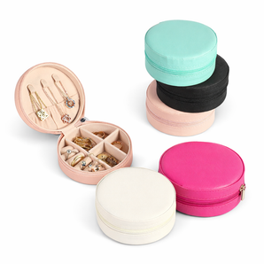 Round jewelry cases in various colors with jewelry inside on a white background