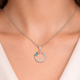 Urban Pizazz Model Wearing aSterling Silver Open Circle Pendant Necklace with Cubic Zirconia Details