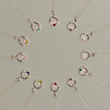 Silver Claddagh Birthstone Necklaces displayed in a circle