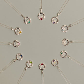 Silver Claddagh Birthstone Necklaces displayed in a circle