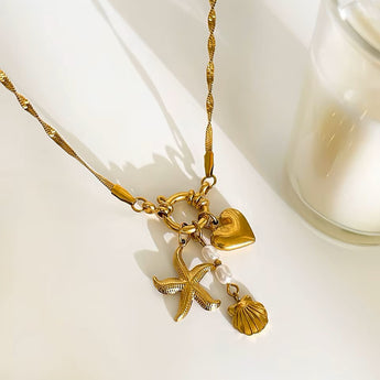 Amnesia Jewellery | Gold Plated and Pearl Droplet twisted sea necklace