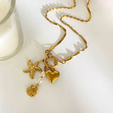 Amnesia Jewellery | Gold Plated and Pearl Droplet twisted sea necklace