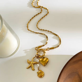 Amnesia Jewellery | Gold Plated and Pearl Droplet twisted sea necklace