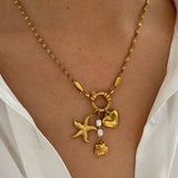 Amnesia Jewellery | Gold Plated and Pearl Droplet twisted sea necklace